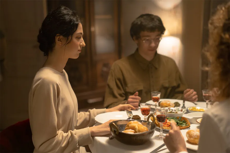 Family sharing a traditional meal during a Jewish heritage tour in Spain

.